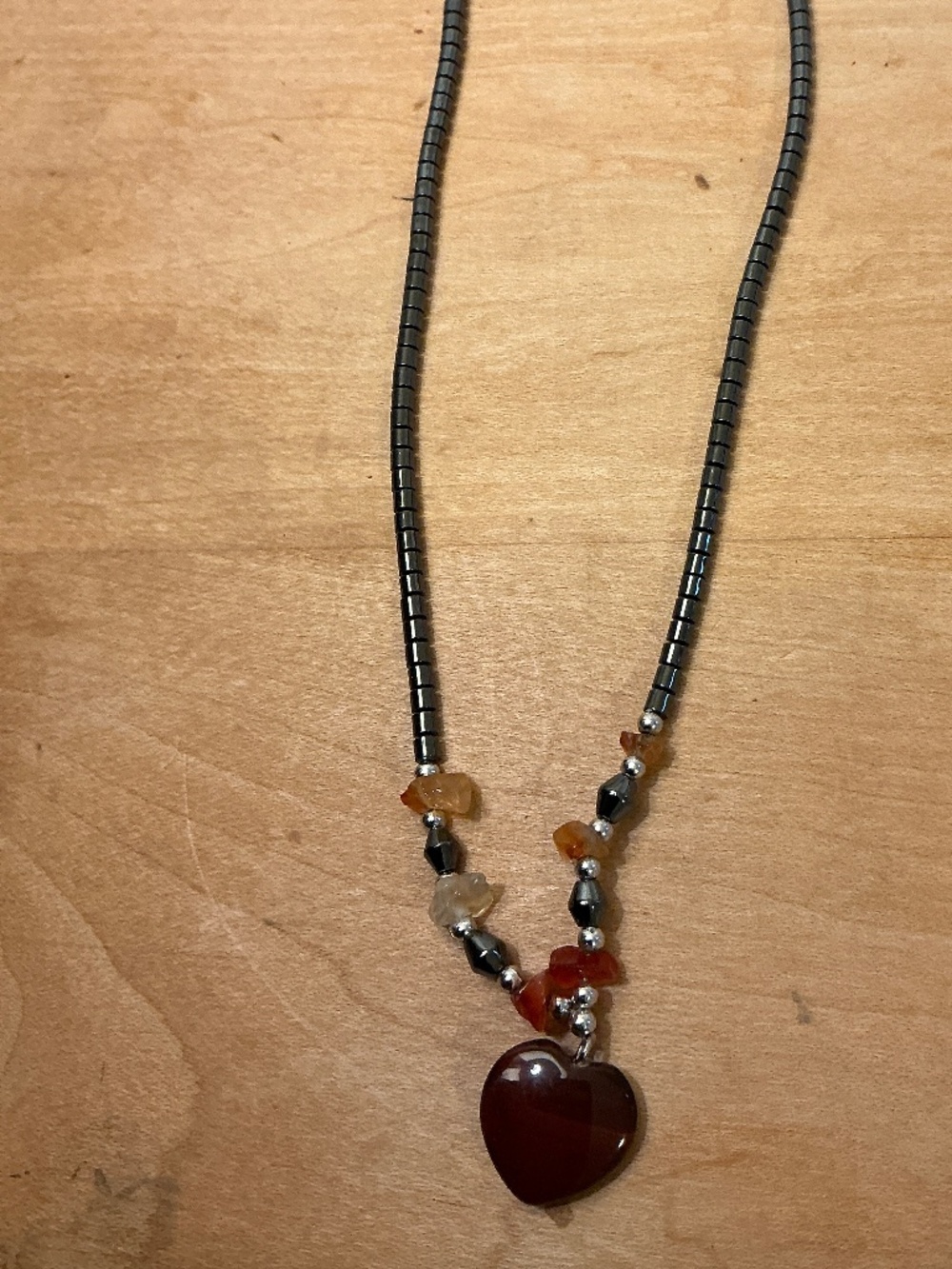 Carved Carnelian heart Hematite bead necklace, barrel clasp.